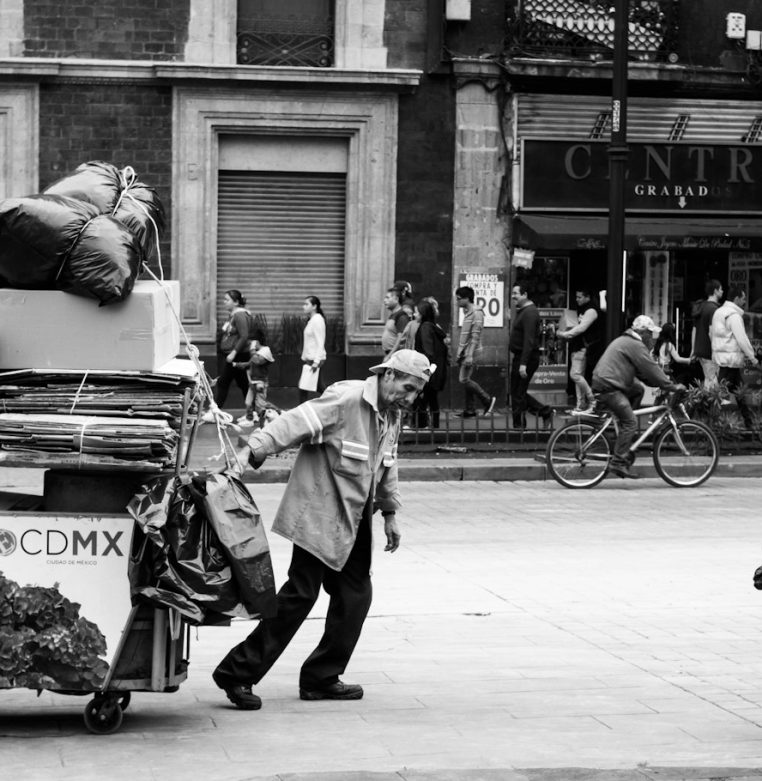 Man pulling a wagon with cardboard boxes
